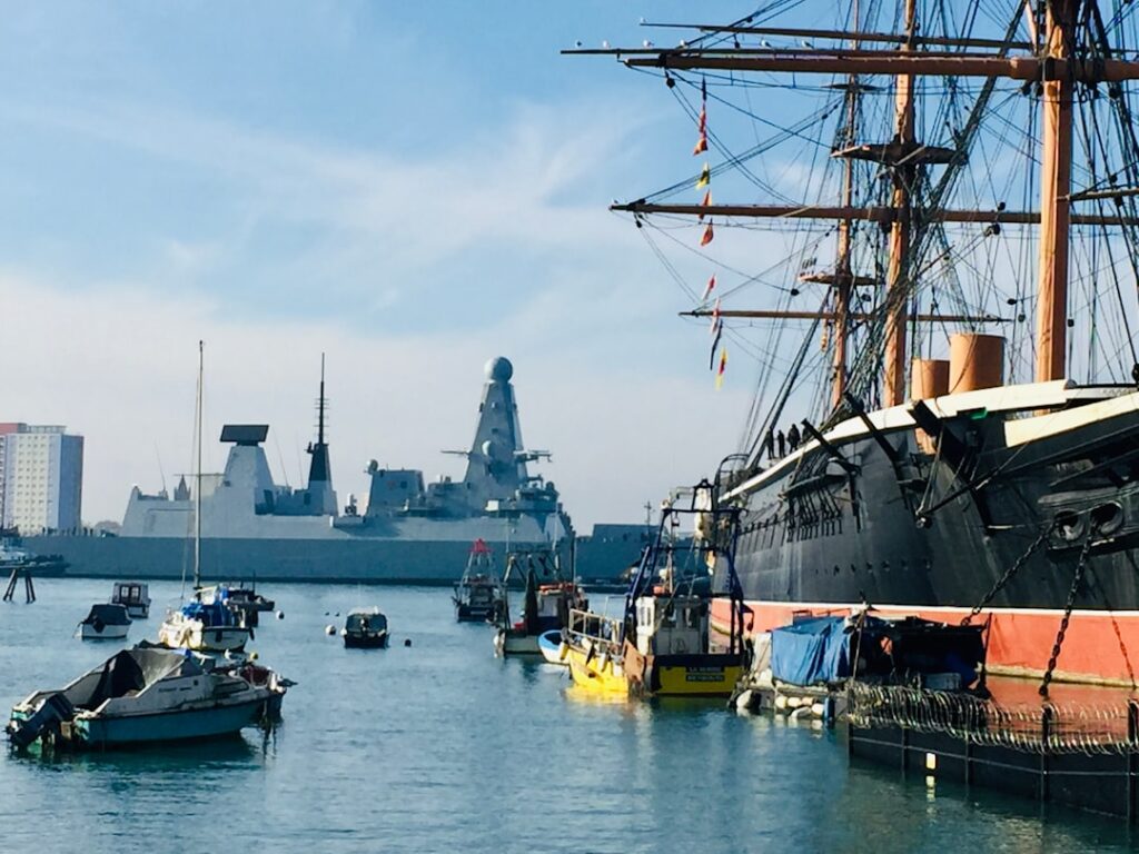 HMS Warrior with modern Uk Navy Ship.